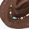 Cowboy-hattu, jossa on simpukkakoriste